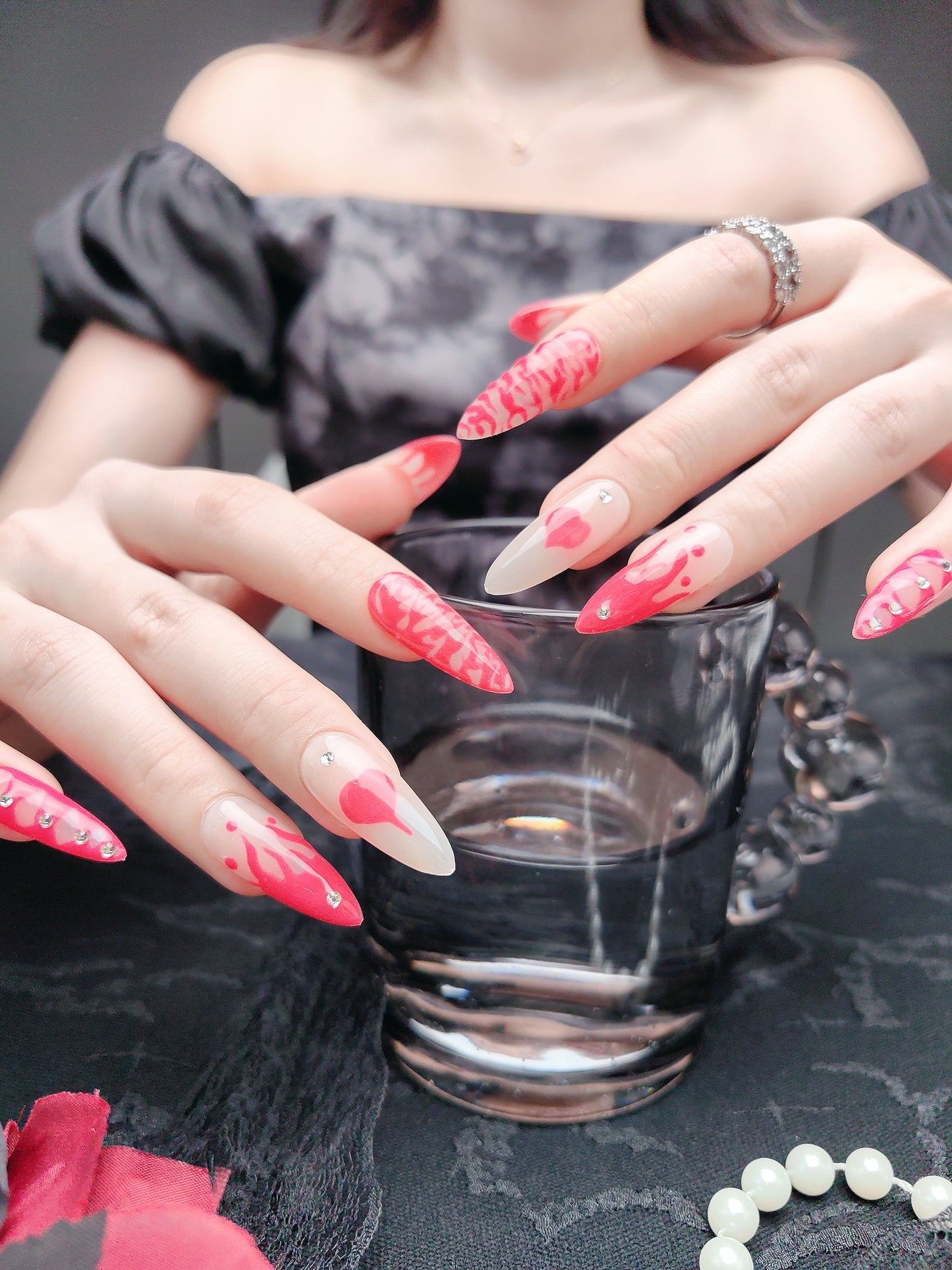 Pink press-on nails with diamonds